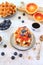 Traditional Belgian waffles, blood oranges and blueberries dressing and coffee for sweet breakfast