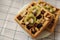 Traditional Belgium waffles with fruit and nuts on white pate and towel