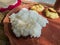 Traditional bengali home cooked thali or platter served on plate made of clay. boiled rice, lentil and potato. authentic indian