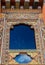 Traditional Bhutanese ornate temple window in Bhutan, South Asia.