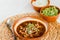 Traditional birria de res from Mexico, on a white background