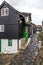 Traditional black wood and stone houses near the harbour in Tors