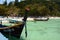 Traditional boats on Kahung beach. Coral island. Phuket province. Thailand