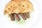 Traditional bosnian food cevapi with flat bread and onion