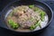 Traditional braised Italian ossobuco alla Milanese with baby broccoli and herb in white wine meat sauce