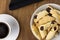 Traditional Brazilian buttered cookies stuffed with guava paste called goiabinha ou beliscÃ£o in a white bowl in wood bakground