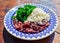 Traditional Brazilian feijoada with cabbage and rice