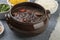 Traditional brazilian feijoada with rice, orange, kale and pepper