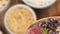 Traditional brazilian feijoada in a spoon over unfocused background