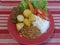 Traditional Brazilian lunch plate with meat, beans, rice, potatoes, carrots, tomatoes and lettuce