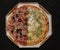 Traditional Brazilian pizza half with Calabrian sausage and half four cheeses in top view.