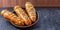 Traditional bread of the dead in Ecuador. Bread babies on a black background with copyspace