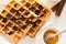 Traditional breakfast: coffee, belgian waffles with honey and chocolate sauce