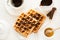 Traditional breakfast: coffee, belgian waffles with honey and chocolate sauce