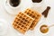 Traditional breakfast: coffee, belgian waffles with honey and chocolate sauce