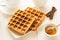 Traditional breakfast: coffee, belgian waffles with honey and chocolate sauce