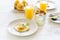 Traditional breakfast with fried egg, yogurt, homemade muffins, citrus curd and orange juice