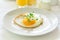 Traditional breakfast with fried egg, yogurt, homemade muffins, citrus curd and orange juice