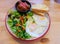 Traditional Breakfast with Omelette, Salad and Bread.