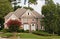 Traditional Brick Home with Blooming Crepe Myrtle