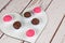 Traditional brigadeiros and bichos de pe on a heart-shaped plate. Brazilian sweets copy space