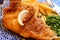 Traditional British food fish and chips served with green peas