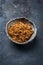 Traditional brown muscovado sugar in a rustic earthenware dish