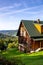 Traditional brown wooden house in Polish highlander mountain style on a hill in a village in Zywiec Beskid Mountains