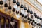 Traditional buddhist wish bells under the roof of a temple in Bangkok, Thailand