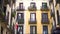 Traditional building facade, Spanish architecture, people walking on street