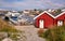 Traditional buildings in the Norwegian fishing bay, ferry, fishing boats