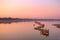 Traditional burmese boats on Taungthaman Lake at sunset, in Amarapura, Mandalay Myanmar