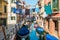 Traditional canal street with reflection in the water laundry hanging out of a typical Venetian facade. Italy