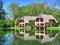 Traditional Cape Dutch house next to lake