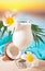 Traditional Caribbean exotic tropical cocktail drink pina colada in a glasses with Plumeria frangipani flowers, palm leaf and