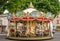 Traditional Carousel with Wooden Horses in an italian town