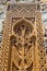 Traditional carved khachkar or cross-stone near Geghard Cathedral, close-up view. Armenian heritage and Art