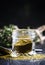 Traditional Caucasian seasoning with herbs and spices, khmeli suneli in a glass jar, black background, selective focus