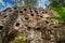 Traditional cave graves carved in the rock at Lemo. Tana Toraja, South Sulawesi, Indonesia