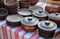 Traditional Ceramic Jugs on Decorative Towel. Showcase of Handmade Ceramic Pottery in a Roadside Market with Ceramic Pots and