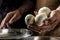 Traditional Cheesemaking, The processing Traditional Italian mozzarella, Cheesemaker, showing freshly made mozzarella