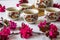 Traditional cherry blossom decorated Japanese tea set filled with green tea and fresh red cheery blossom