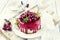 Traditional cherry cheesecake with fruits on design plate