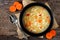 Traditional chicken noodle soup, overhead scene on rustic wood