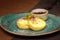 Traditional children`s breakfast and cheesecakes, cottage cheese pancakes, on a plate with syrup and jam. Creative serving,
