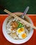 Traditional chinese food in thailand by top view, Local white noodle in chicken soup  with topping of pressed pork boiled egg