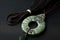 traditional chinese jade pendant on silk cloth