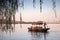 Traditional Chinese wooden boat with boatman