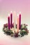 Traditional christian religious advent wreath with 5 candles, 4 candles burning