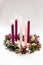 Traditional christian religious advent wreath with 5 candles, three candles burning